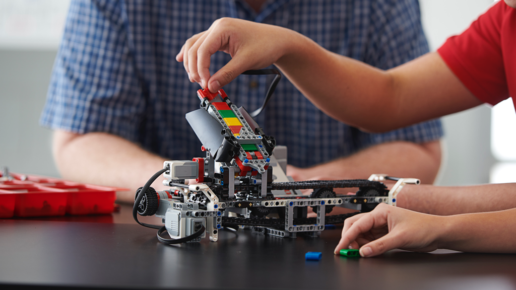Close-up of students learning problem-solving and critical thinking with LEGO® MINDSTORMS® Education EV3.